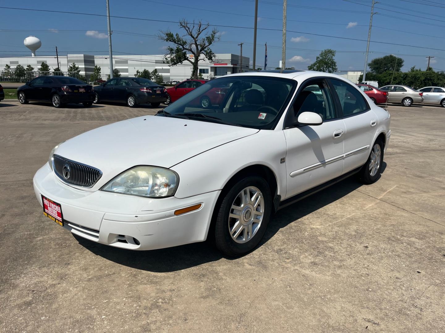 2004 white /TAN Mercury Sable LS Premium (1MEHM55S54A) with an 3.0L V6 SOHC 24V engine, 4-Speed Automatic Overdrive transmission, located at 14700 Tomball Parkway 249, Houston, TX, 77086, (281) 444-2200, 29.928619, -95.504074 - Photo#2